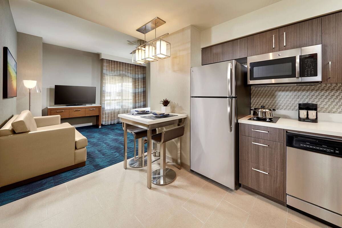 full-sized fridge, microwave, stovetop, dishwasher