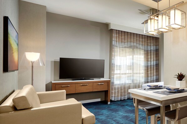 Hypo-allergenic bedding, desk, laptop workspace, blackout drapes