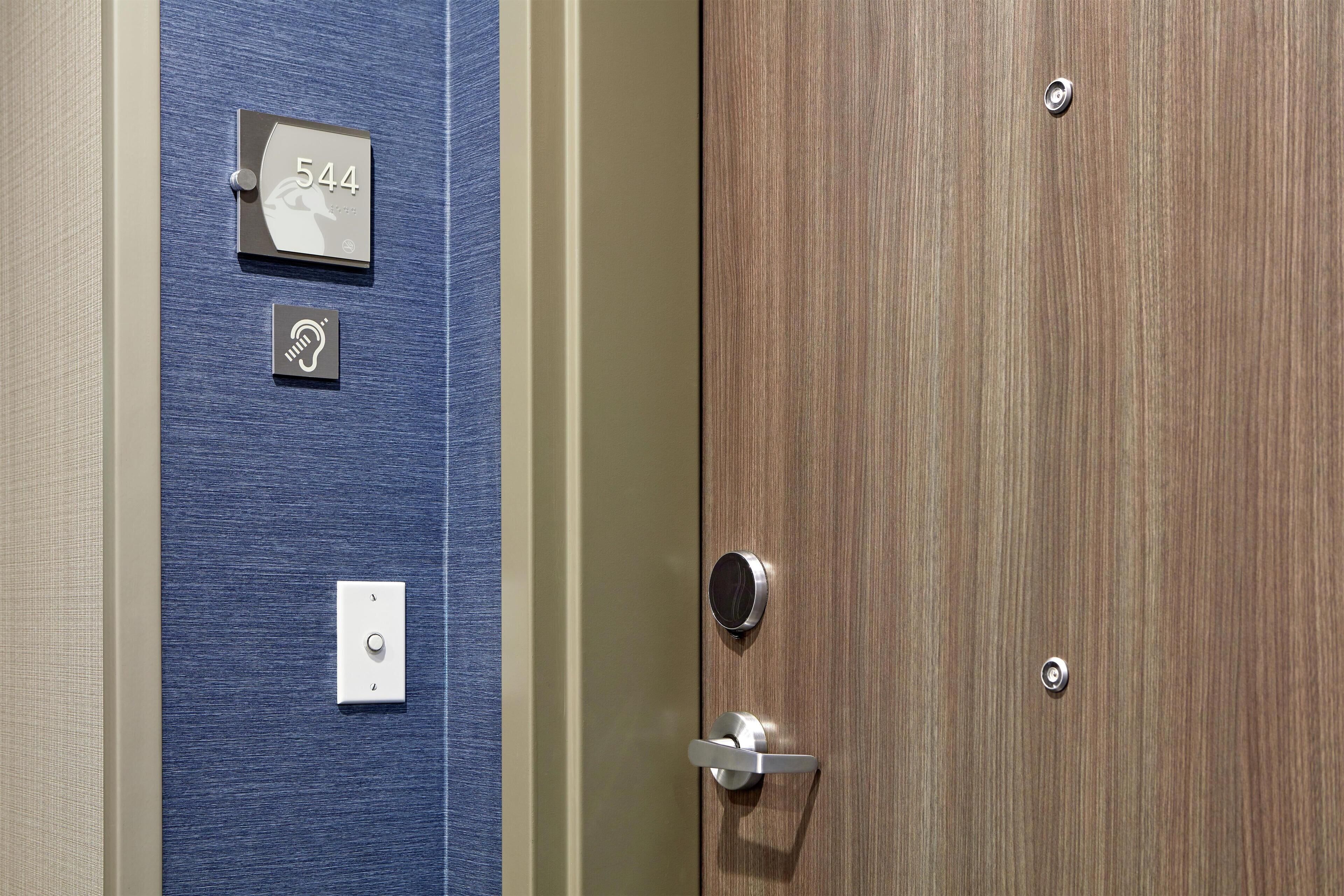 Hypo-allergenic bedding, desk, laptop workspace, blackout drapes