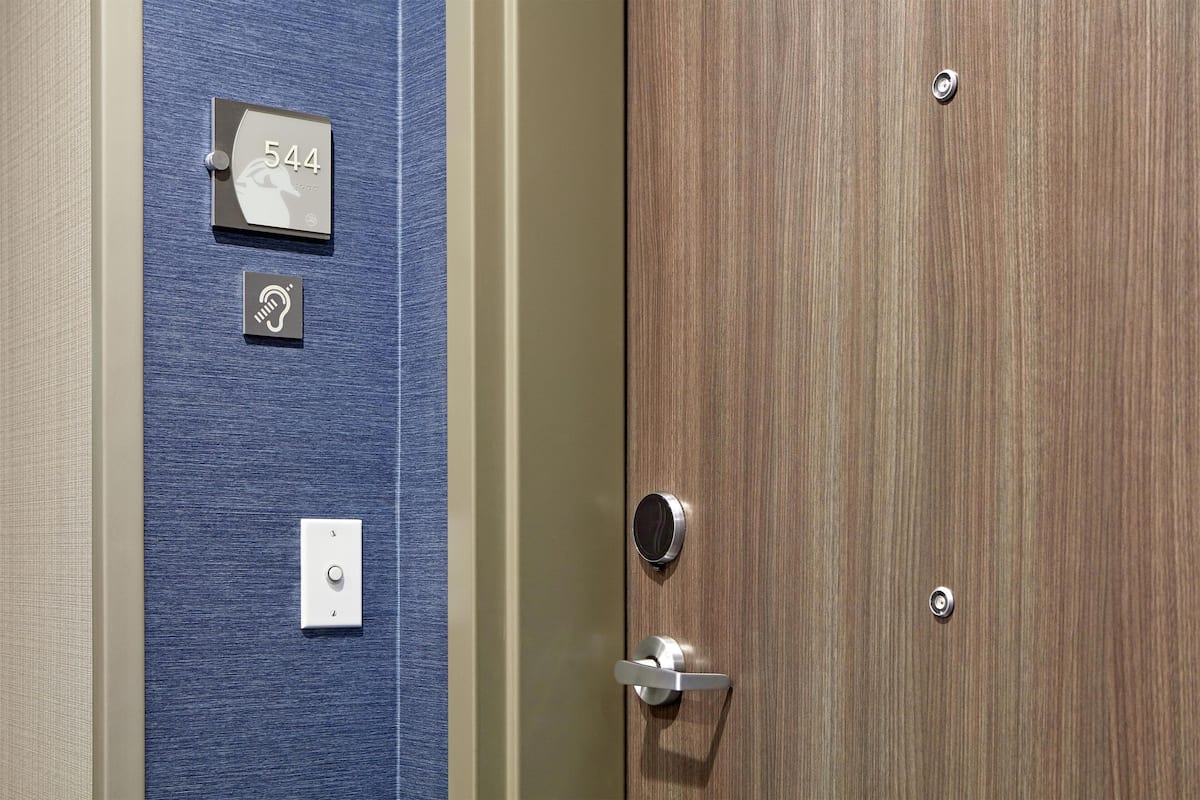 Hypo-allergenic bedding, desk, laptop workspace, blackout drapes