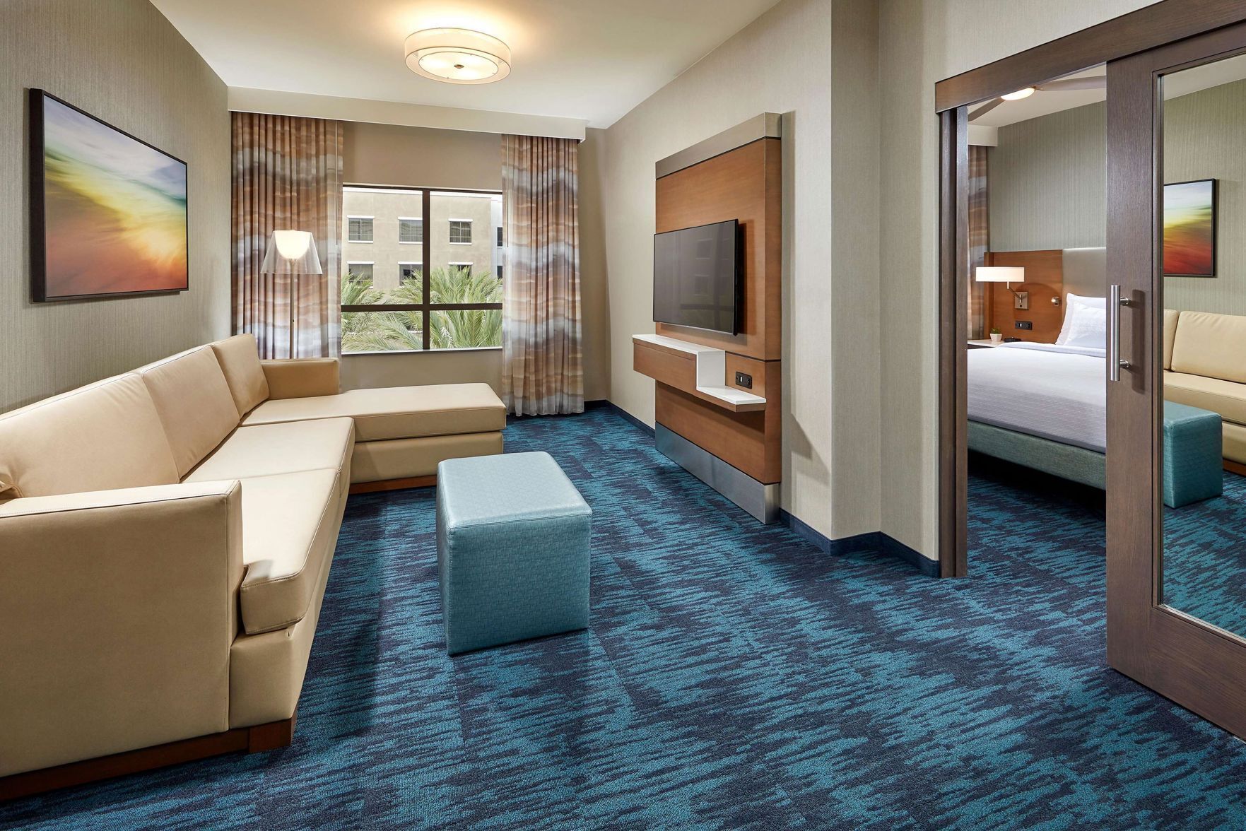 Hypo-allergenic bedding, desk, laptop workspace, blackout drapes