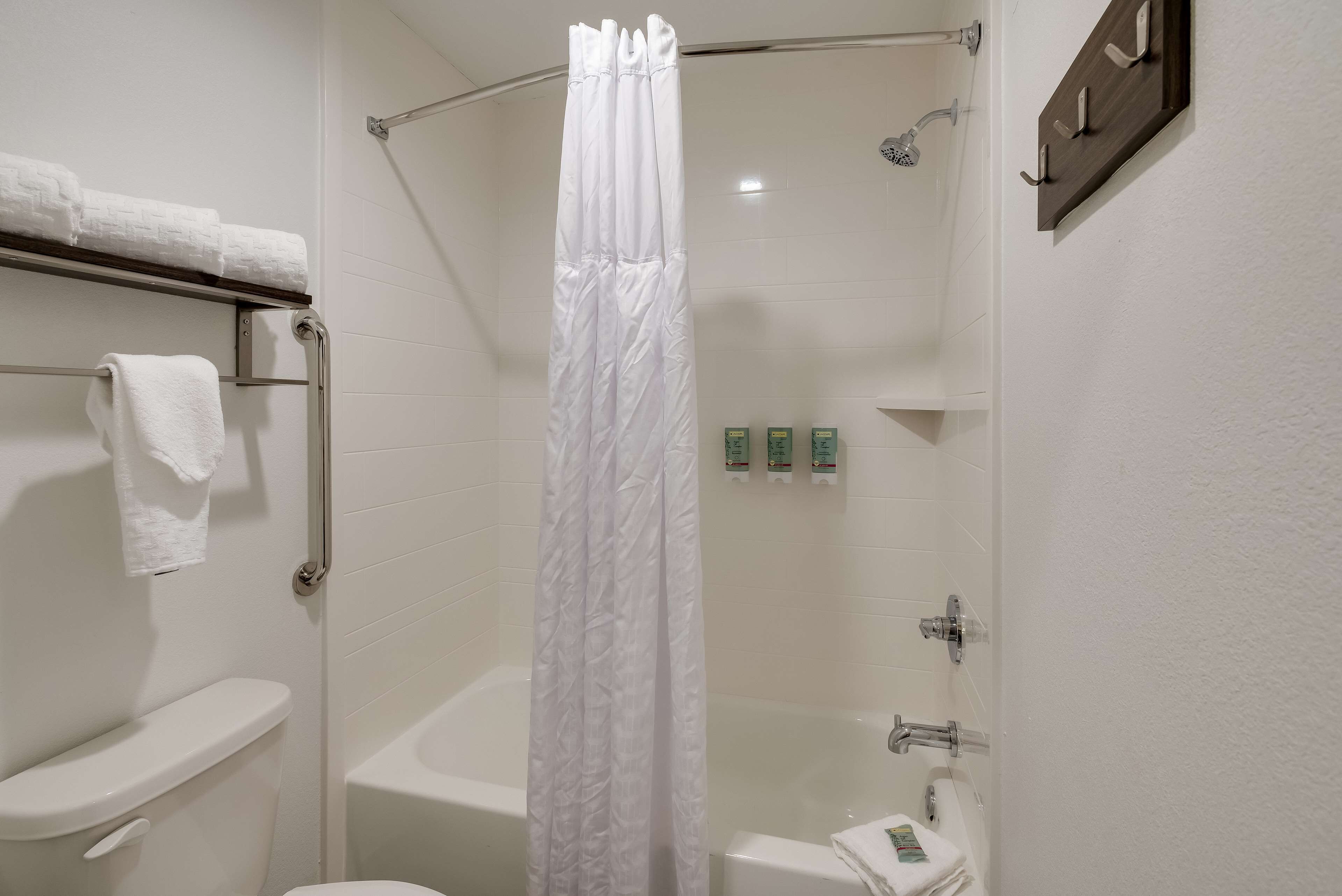 suite, 2 queen beds, non smoking, kitchenette | bathroom | combined shower/bathtub, free toiletries, hair dryer, towels
