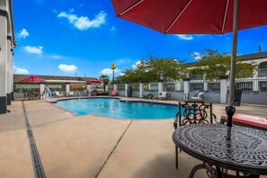 Seasonal outdoor pool, open 9:00 AM to 8:00 PM, pool umbrellas