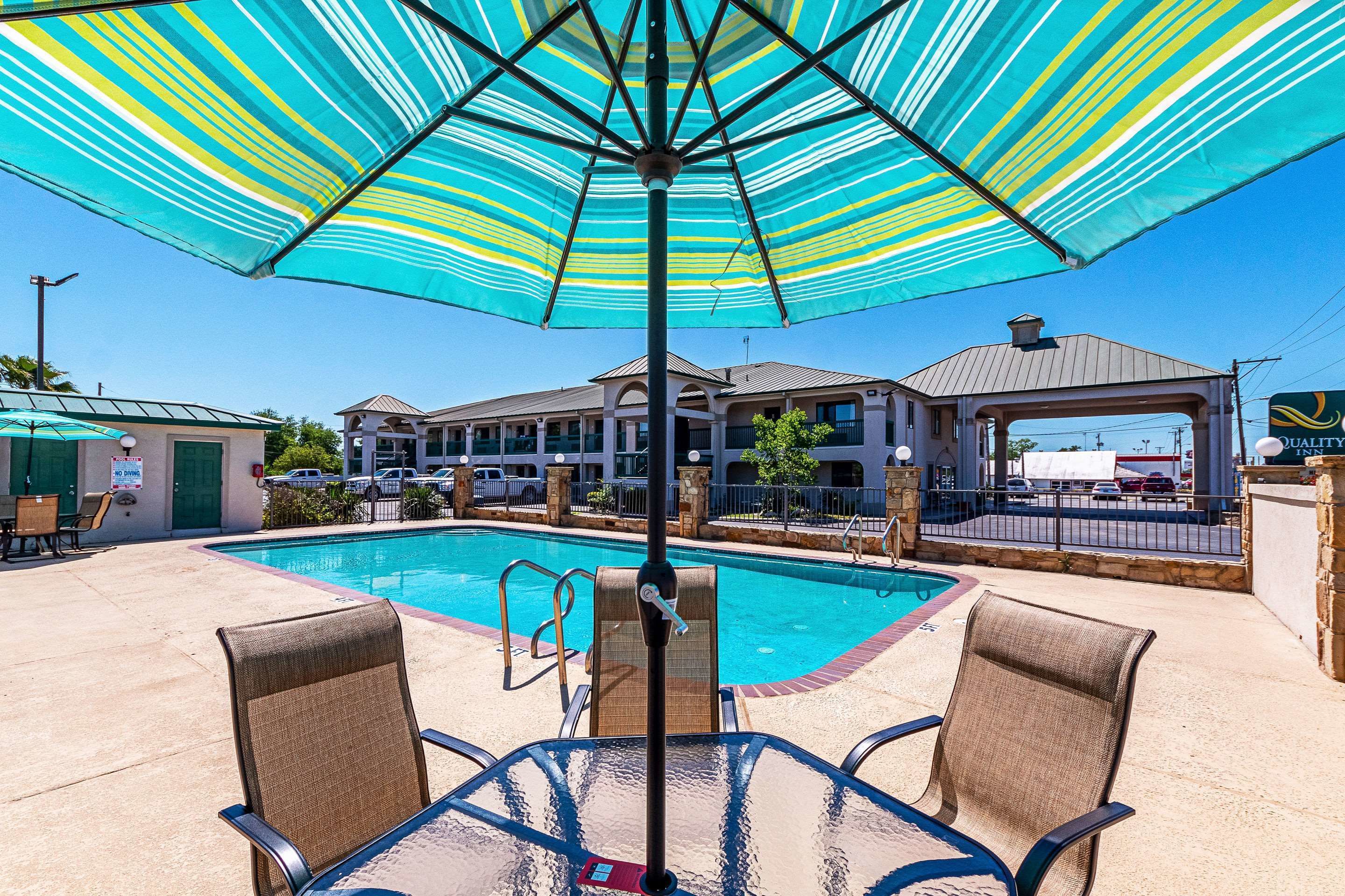 outdoor pool, open 10:00 am to 11 pm, pool umbrellas, pool loungers