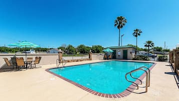 Outdoor pool, open 10:00 AM to 11 PM, pool umbrellas, pool loungers