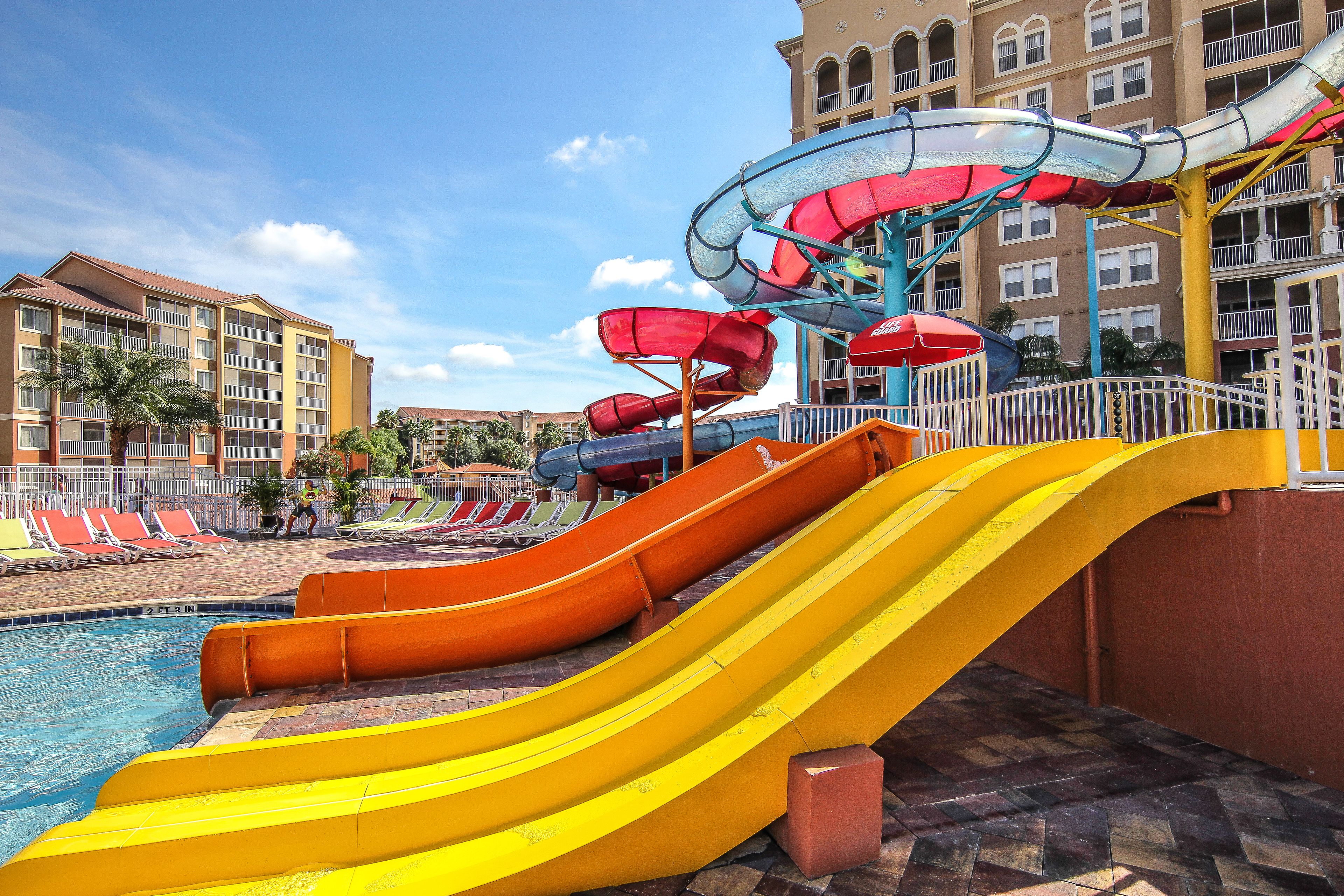 A water park with multiple slides and a pool area.
