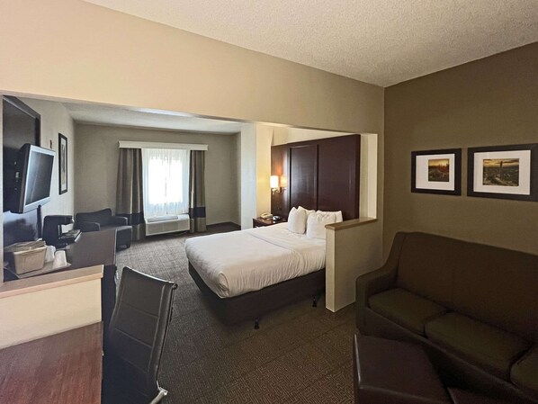 Relax in a stylish room with a large bed, flat-screen TV, and comfortable seating area.