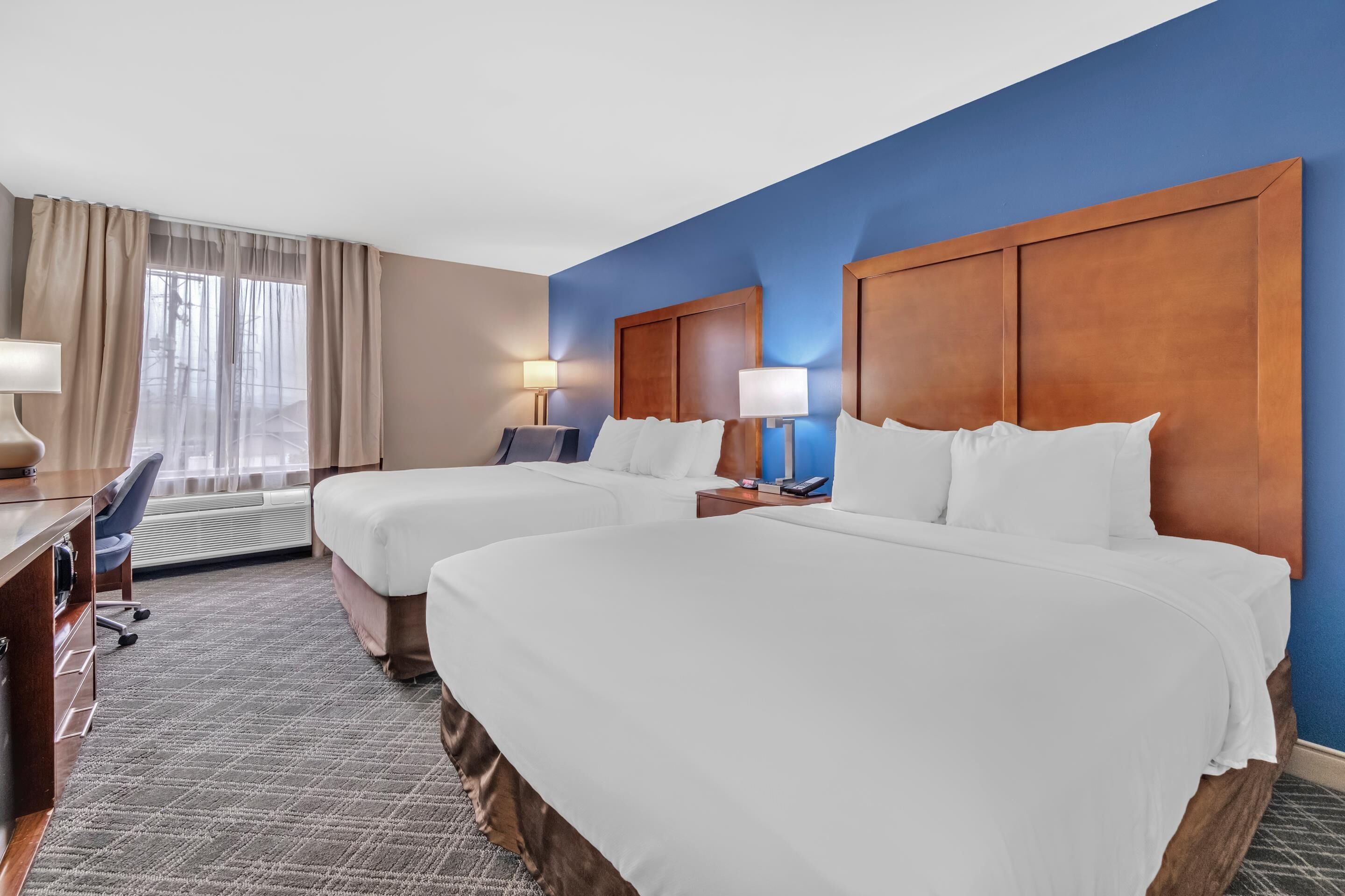 Desk, laptop workspace, blackout drapes, iron/ironing board