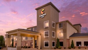 A Comfort Inn hotel with a modern design, featuring a prominent logo on the building, a covered entrance, and a parking area. - Comfort Inn Somerset - Lake Cumberland (Somerset)