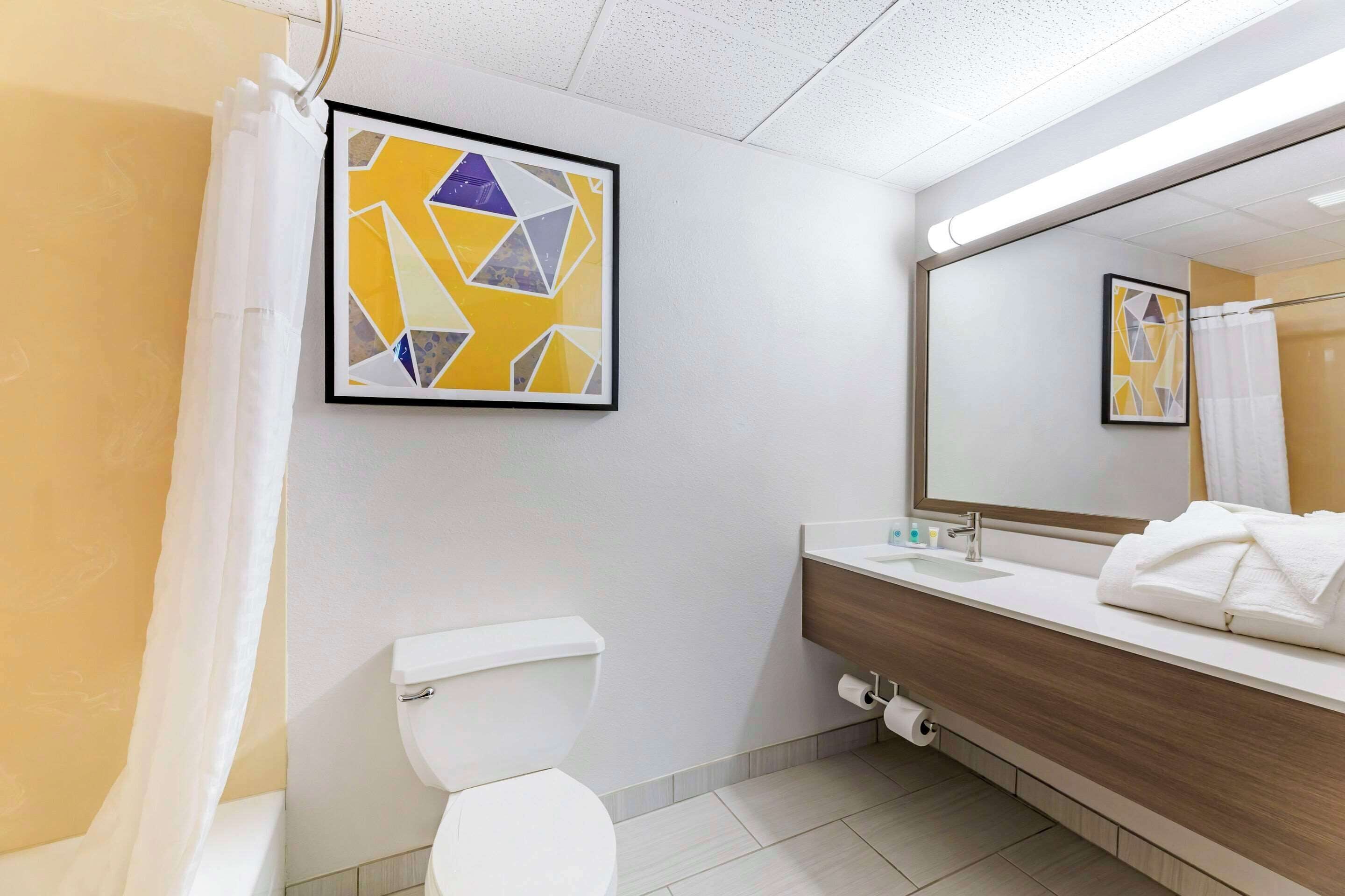 premium bedding, desk, blackout curtains, iron/ironing board