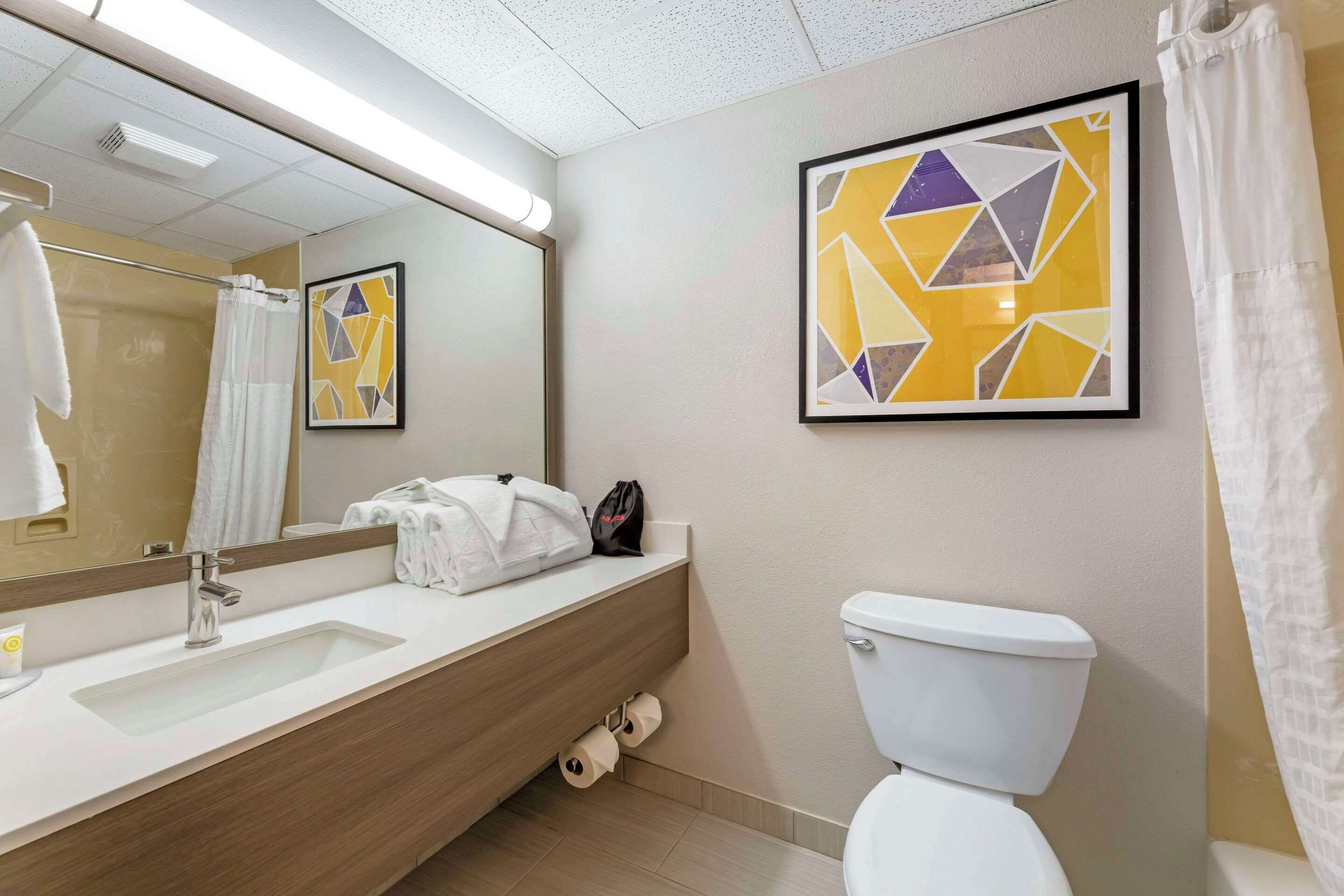 premium bedding, desk, blackout curtains, iron/ironing board