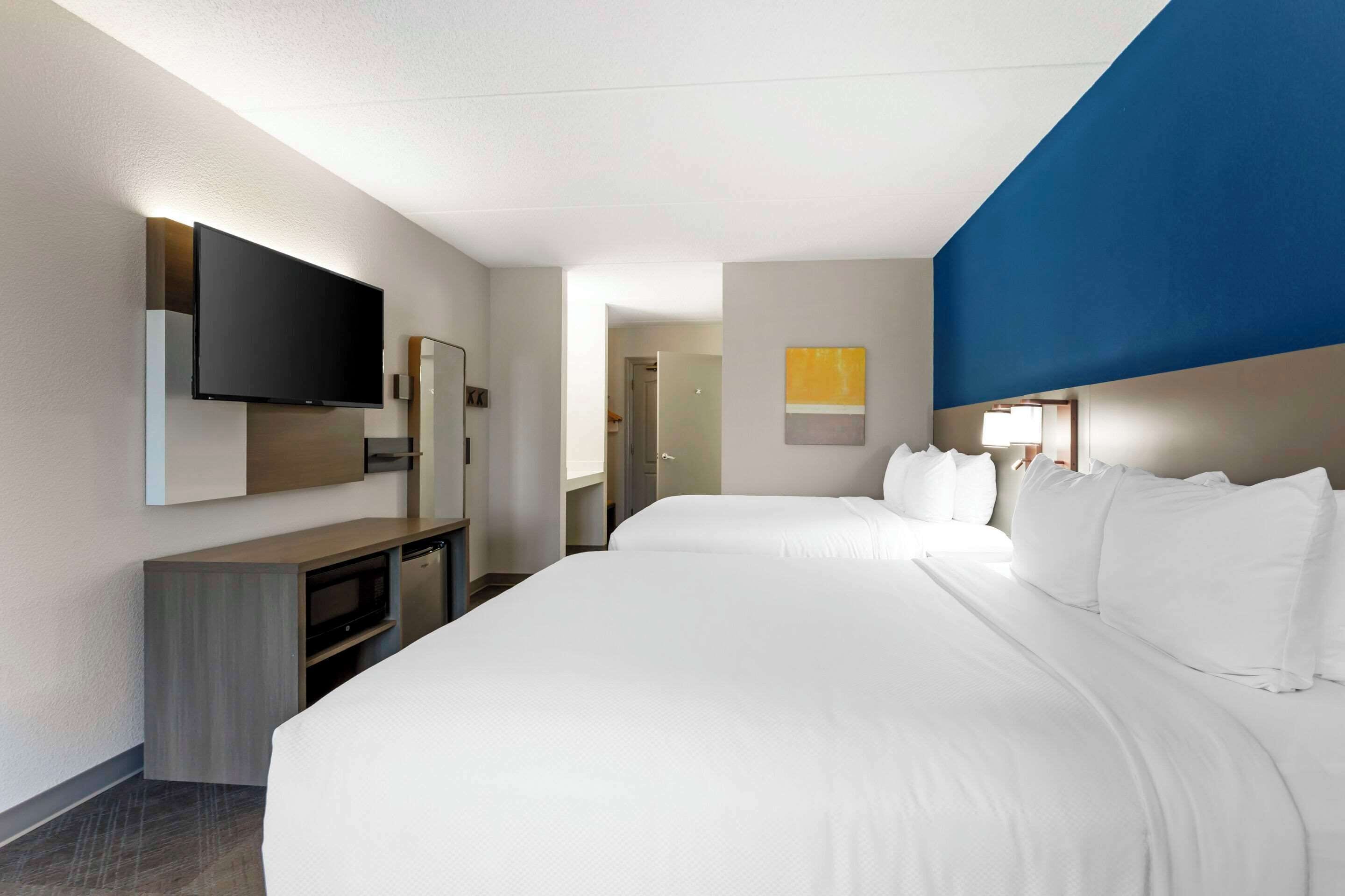 premium bedding, desk, blackout curtains, iron/ironing board