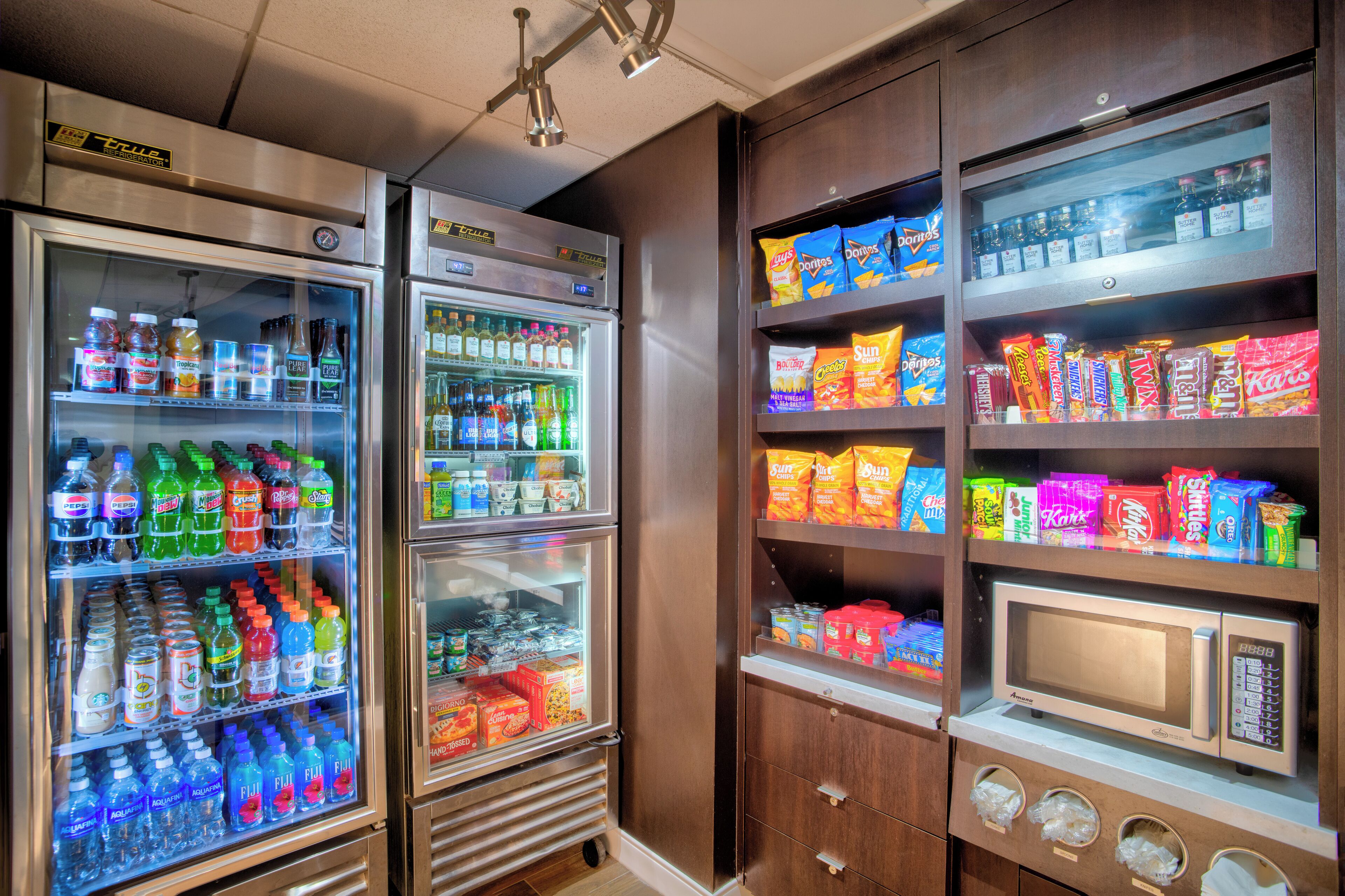 A vending machine area with various snacks and drinks.