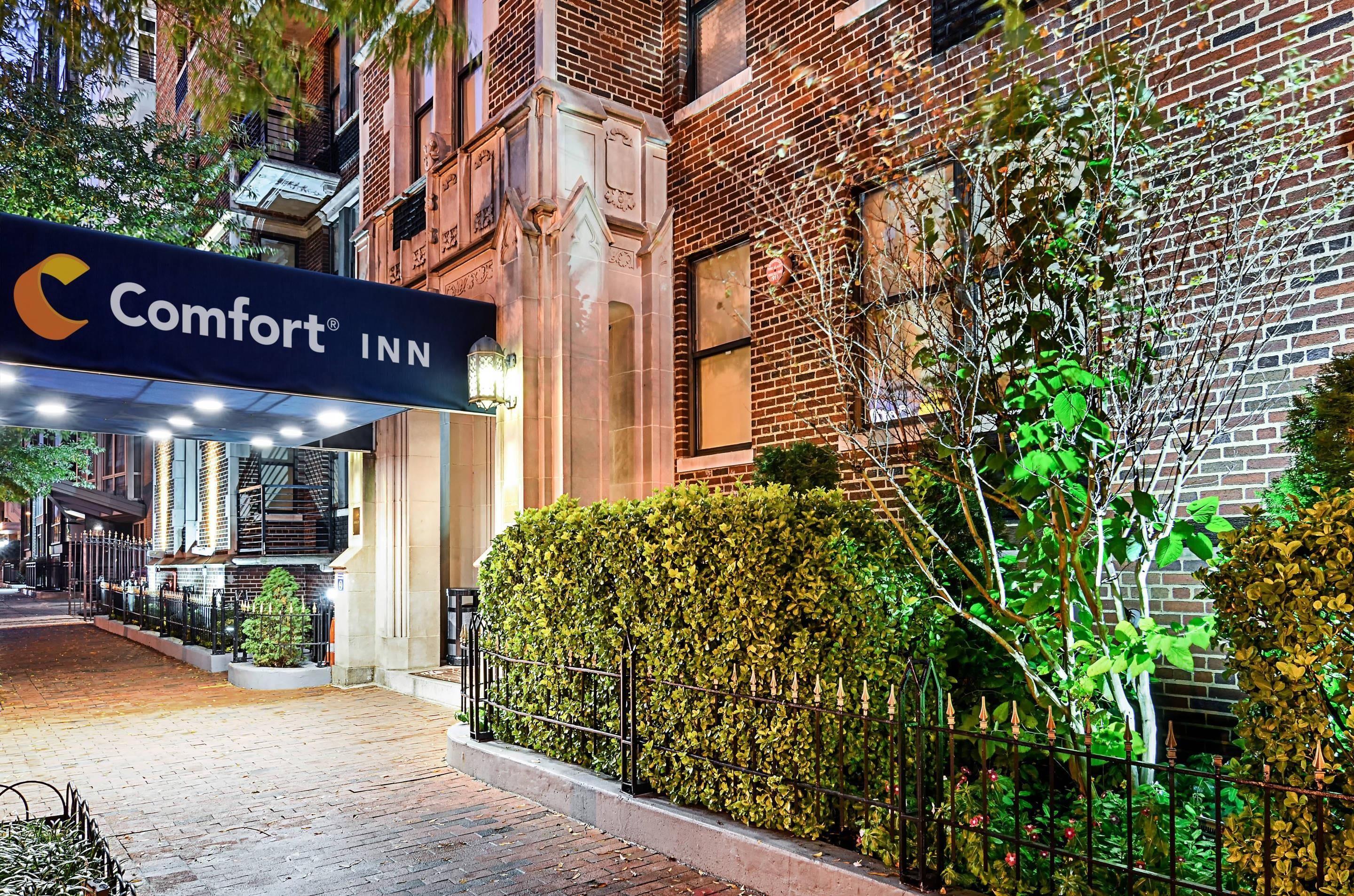 A brick building with a sign for Comfort INN.