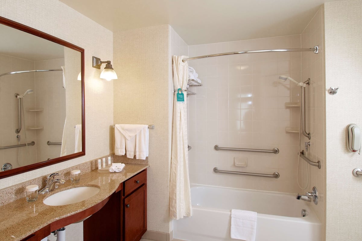 suite, 2 queen beds, accessible, bathtub | bathroom | hair dryer, towels, soap, shampoo