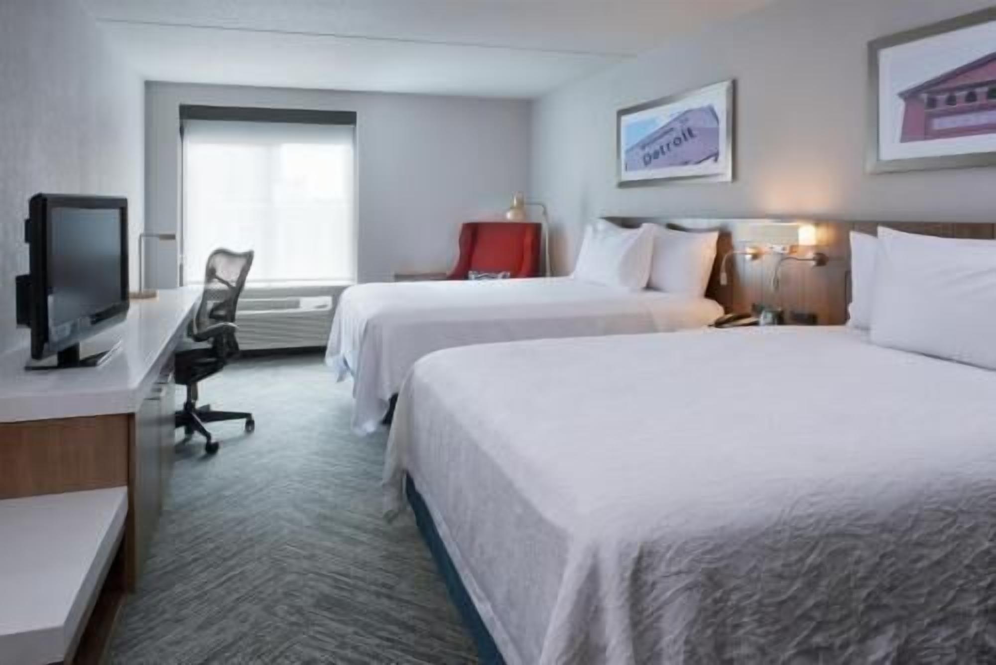 Premium bedding, desk, laptop workspace, blackout curtains