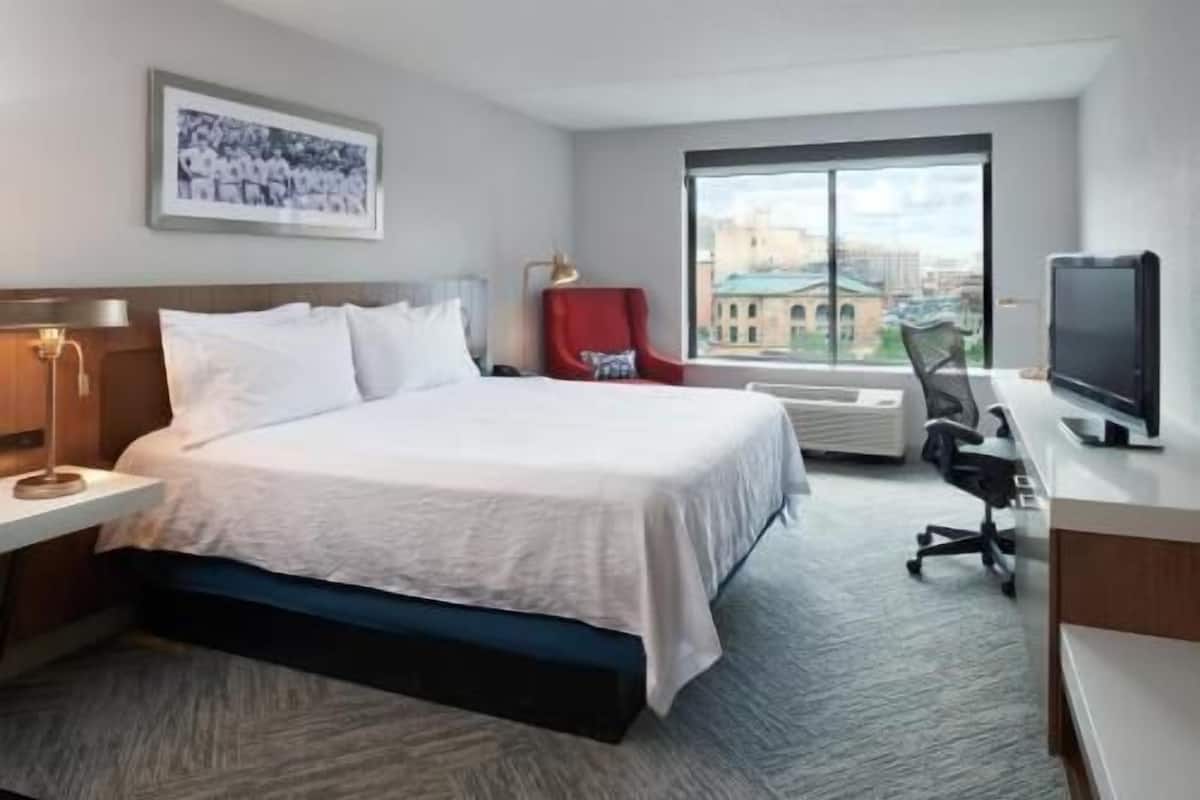 Premium bedding, desk, laptop workspace, blackout drapes