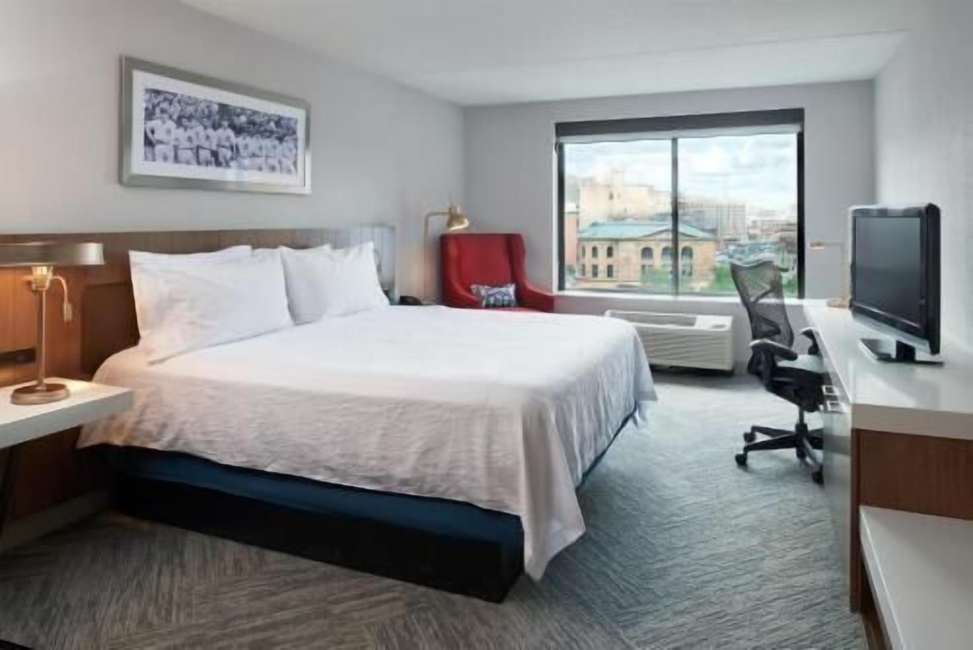 Premium bedding, desk, laptop workspace, blackout drapes