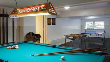 Enjoy a game of pool or foosball in this spacious indoor recreation area.