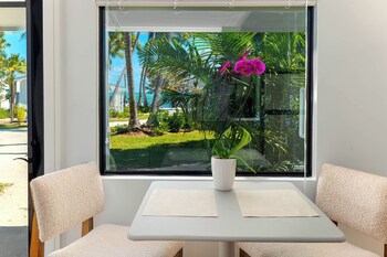 Oceanview King Room | Premium bedding, individually decorated, individually furnished at Pines & Palms Resort