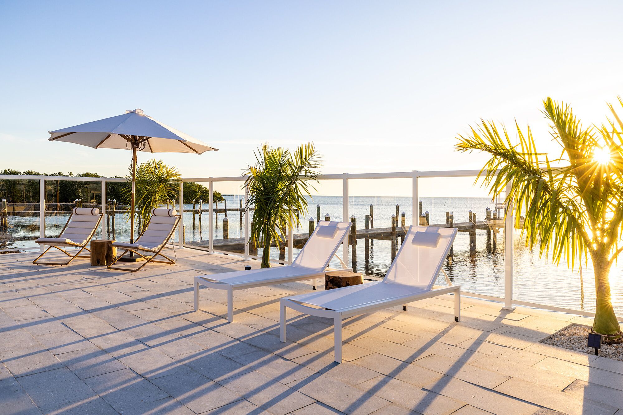 outdoor pool, a heated pool, pool umbrellas, pool loungers