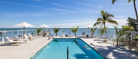 Outdoor pool, a heated pool, pool umbrellas, sun loungers