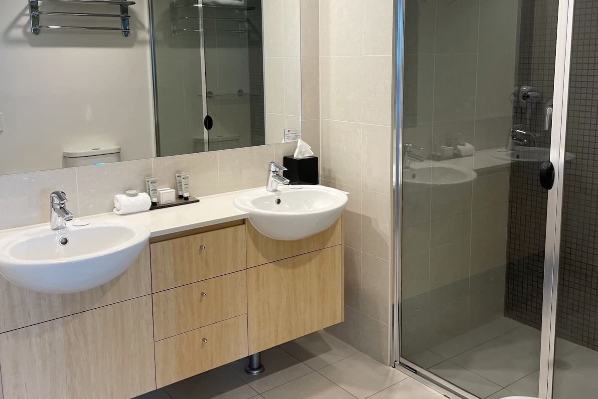 One Bedroom Family Suite | Bathroom | Shower, free toiletries, hair dryer, towels