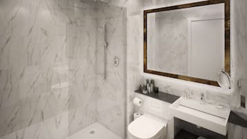 A modern bathroom with a glass-enclosed shower, a white toilet, and a vanity with a mirror.