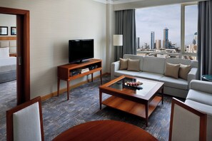 Suite, 2 Twin Beds | Living area | 32-inch flat-screen TV with satellite channels, TV