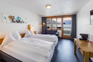 Twin Room with Lake View (incl. City Tax) | In-room safe, desk, laptop workspace, blackout drapes