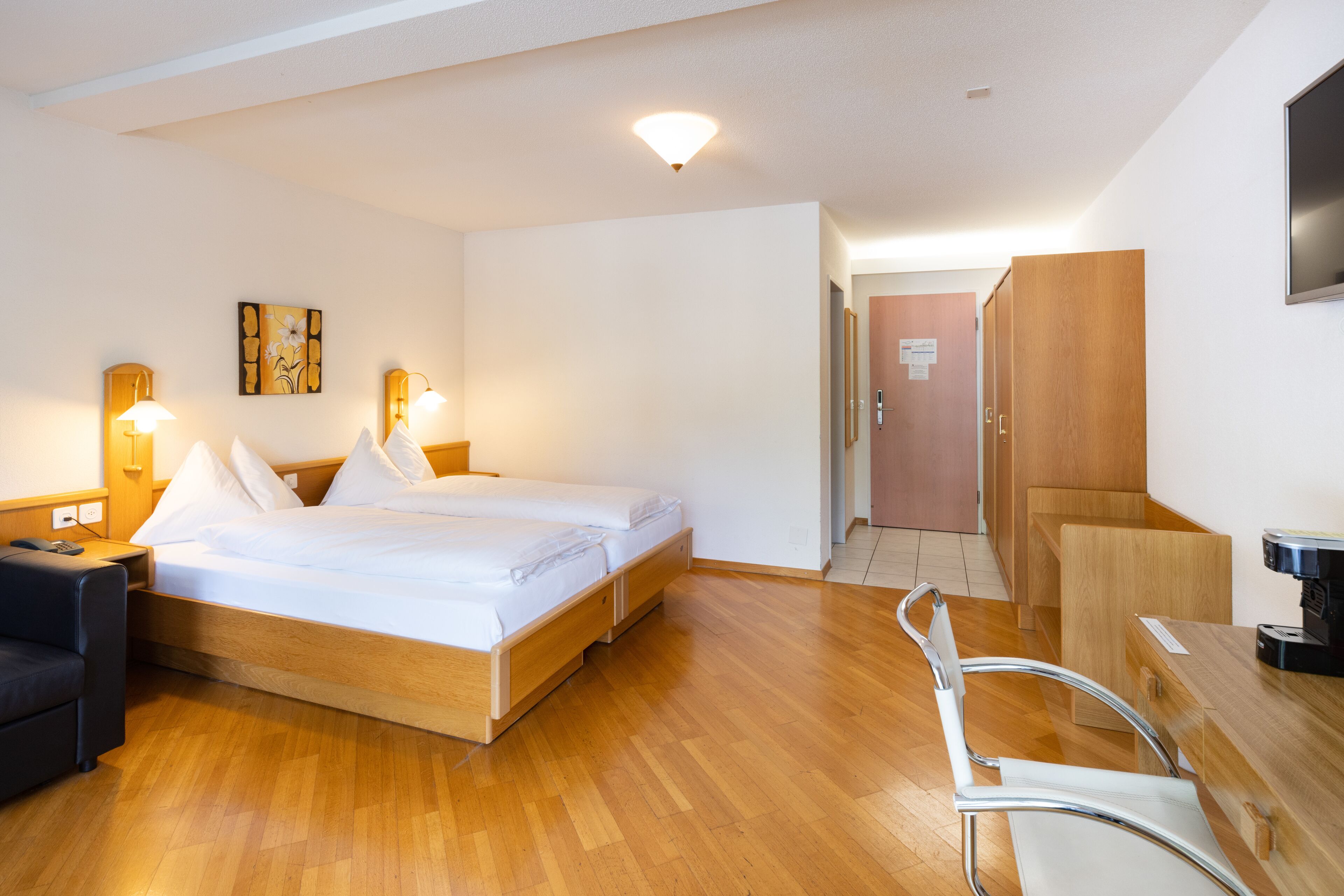 twin room with mountain view (incl. city tax) | in-room safe, desk, laptop workspace, blackout curtains