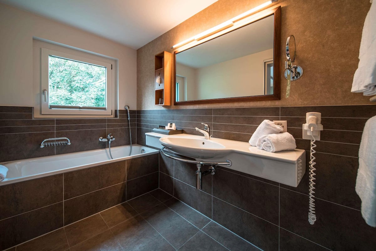 Modern, air-conditioned, Junior Suite, Balcony | Hypo-allergenic bedding, down duvets, in-room safe, desk