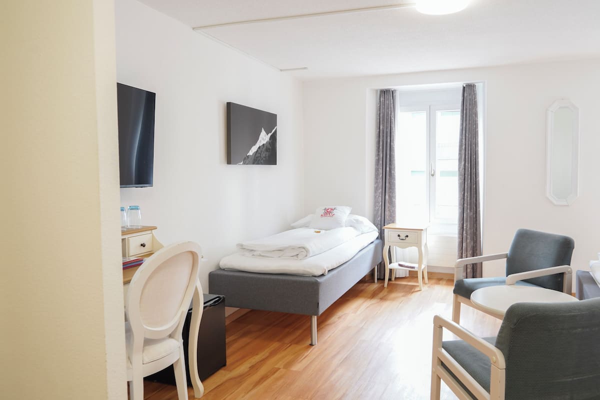 Triple Room | Minibar, in-room safe, desk, blackout curtains