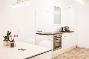 Premium Quadruple Room | Private kitchen - Kurhaus Lenzerheide (Vaz-Obervaz)