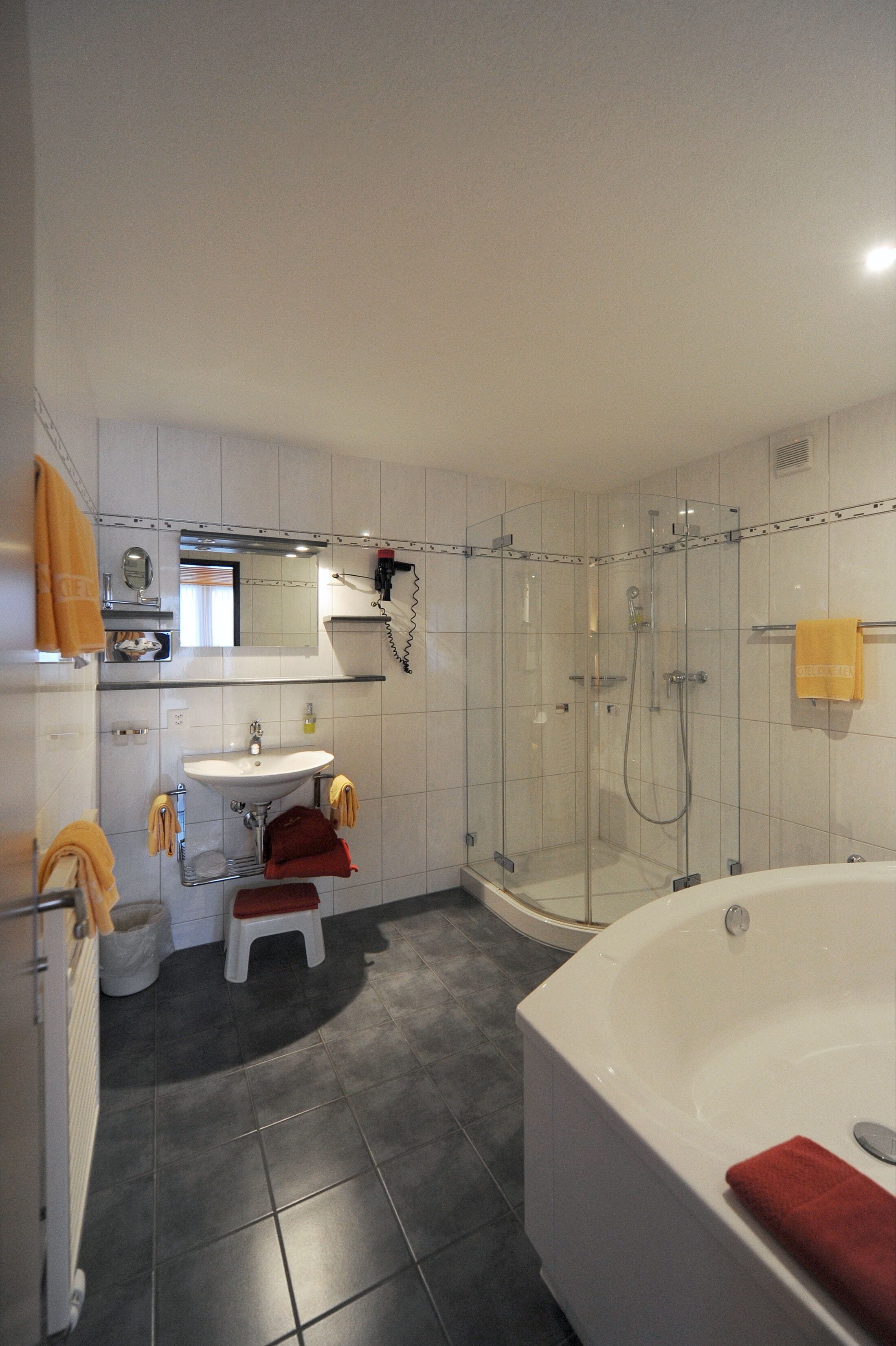 junior suite (deluxe south) | bathroom | shower, hair dryer, towels, soap