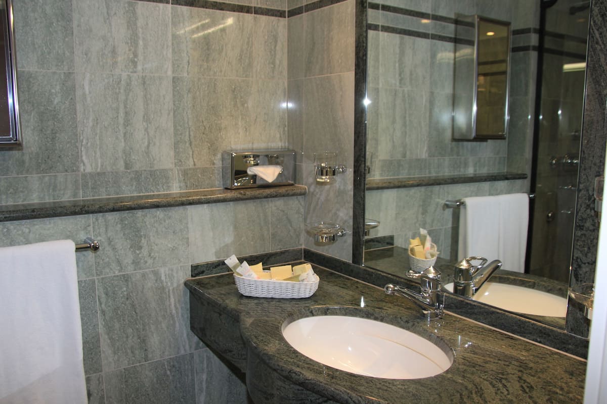 deep-soaking bathtub, eco-friendly toiletries, hair dryer, slippers