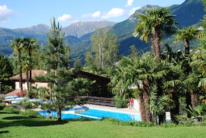 Seasonal outdoor pool, pool umbrellas, pool loungers
