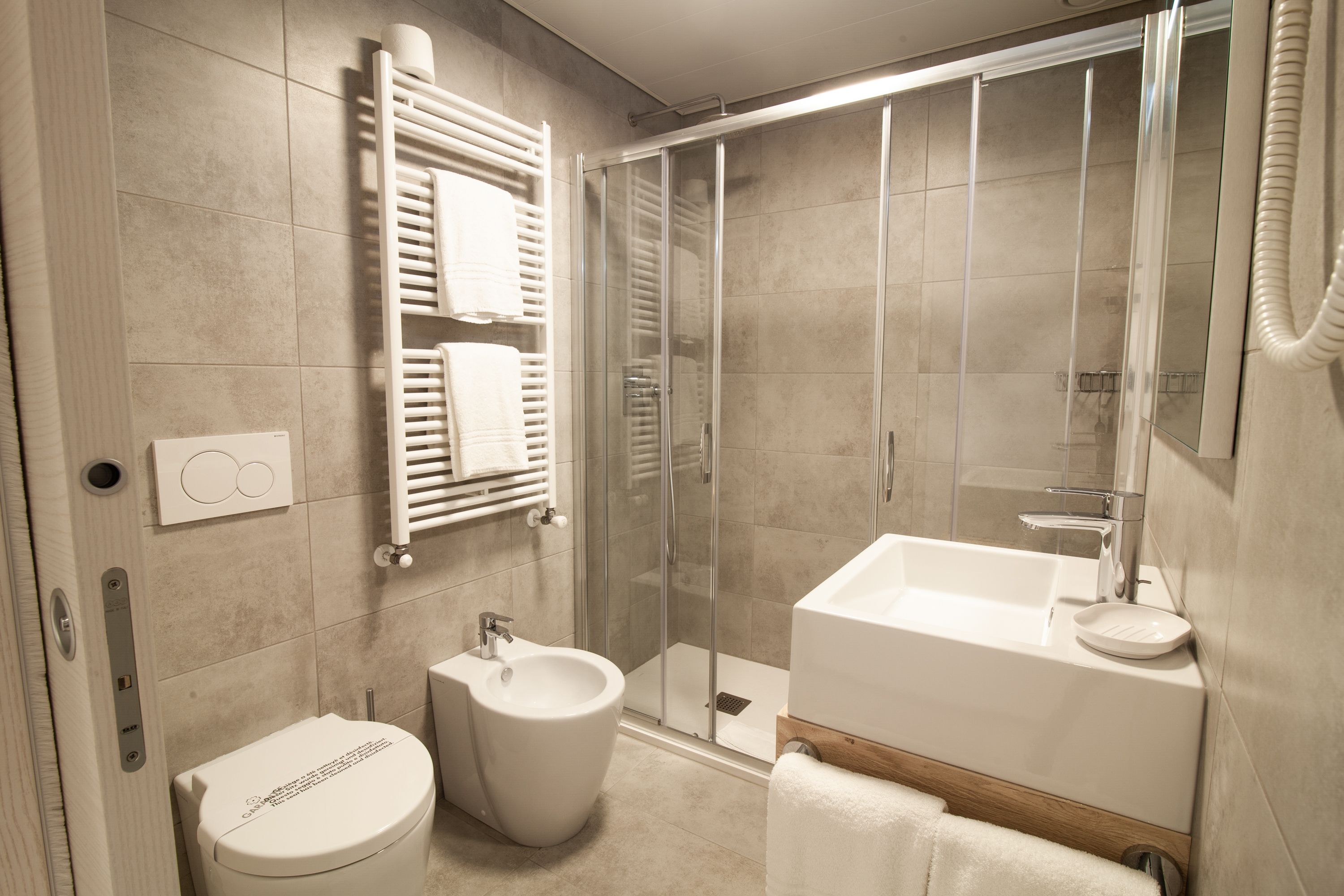 business room | bathroom | hair dryer, bidet, towels