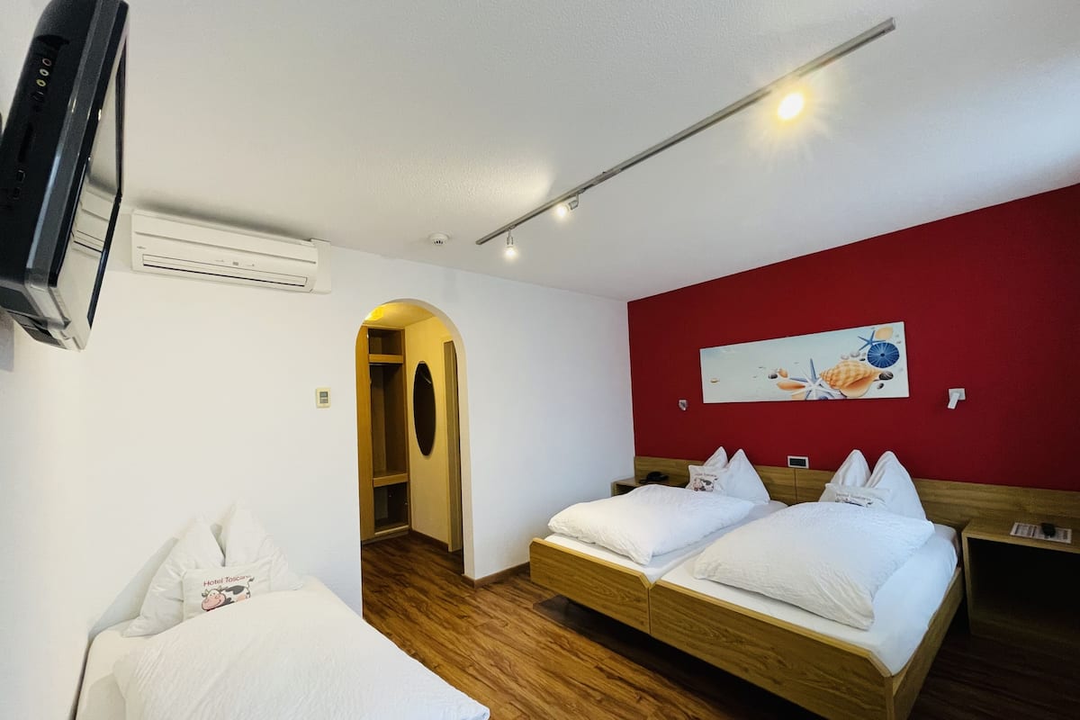 Economy Triple Room, 1 Bedroom | 1 bedroom, in-room safe, desk, laptop workspace