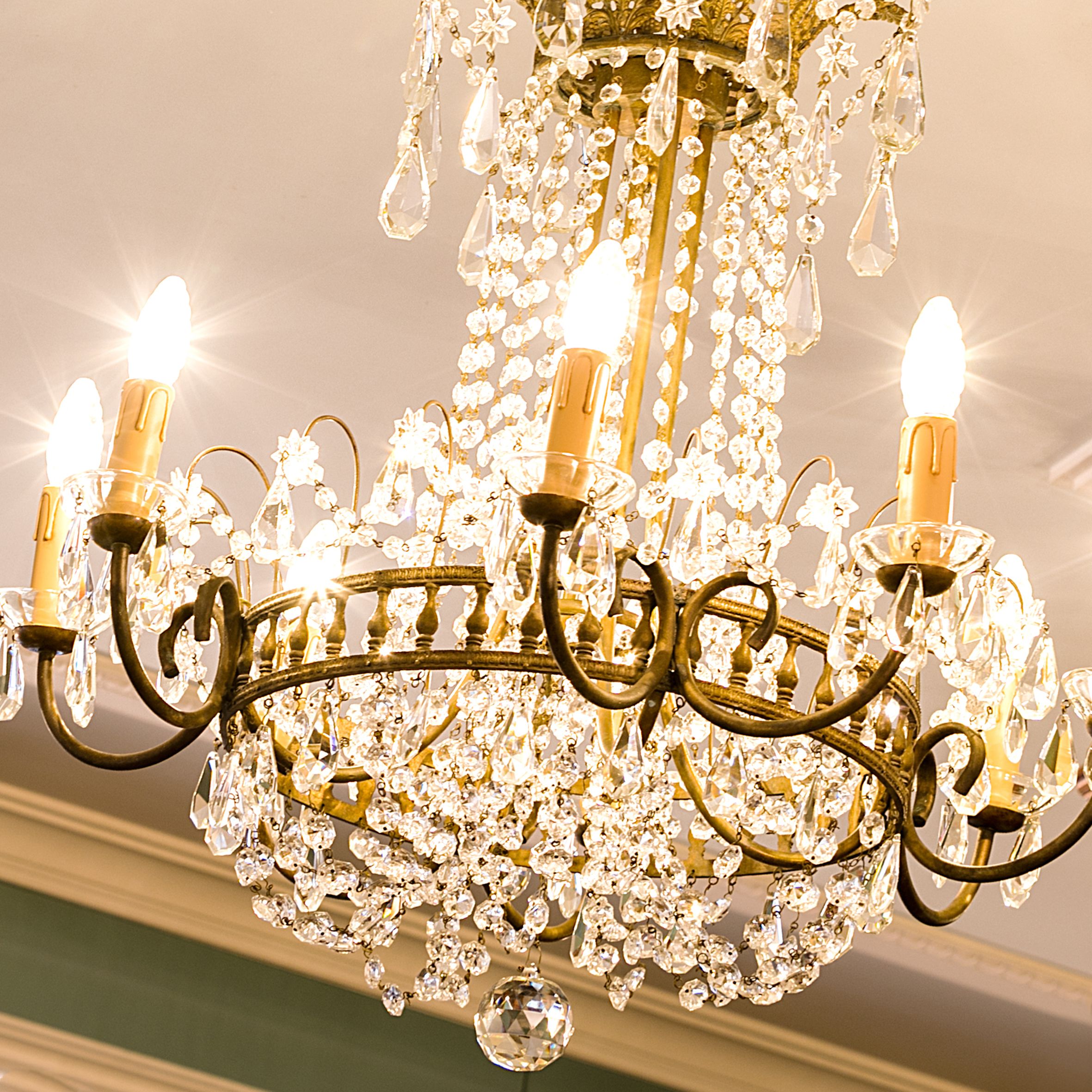 A chandelier with multiple crystal elements and light bulbs.
