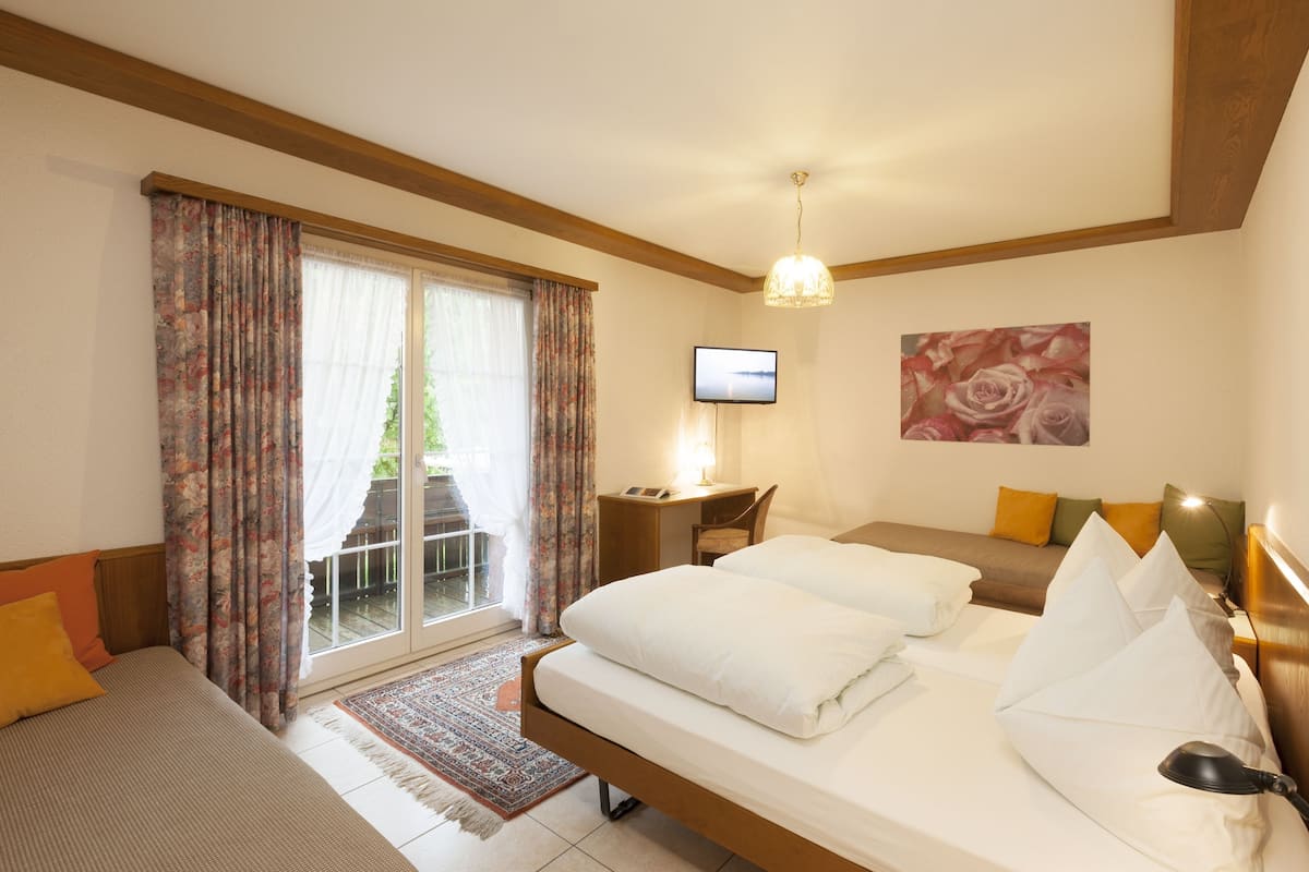 Quadruple Room, Private Bathroom | Down comforters, in-room safe, individually decorated