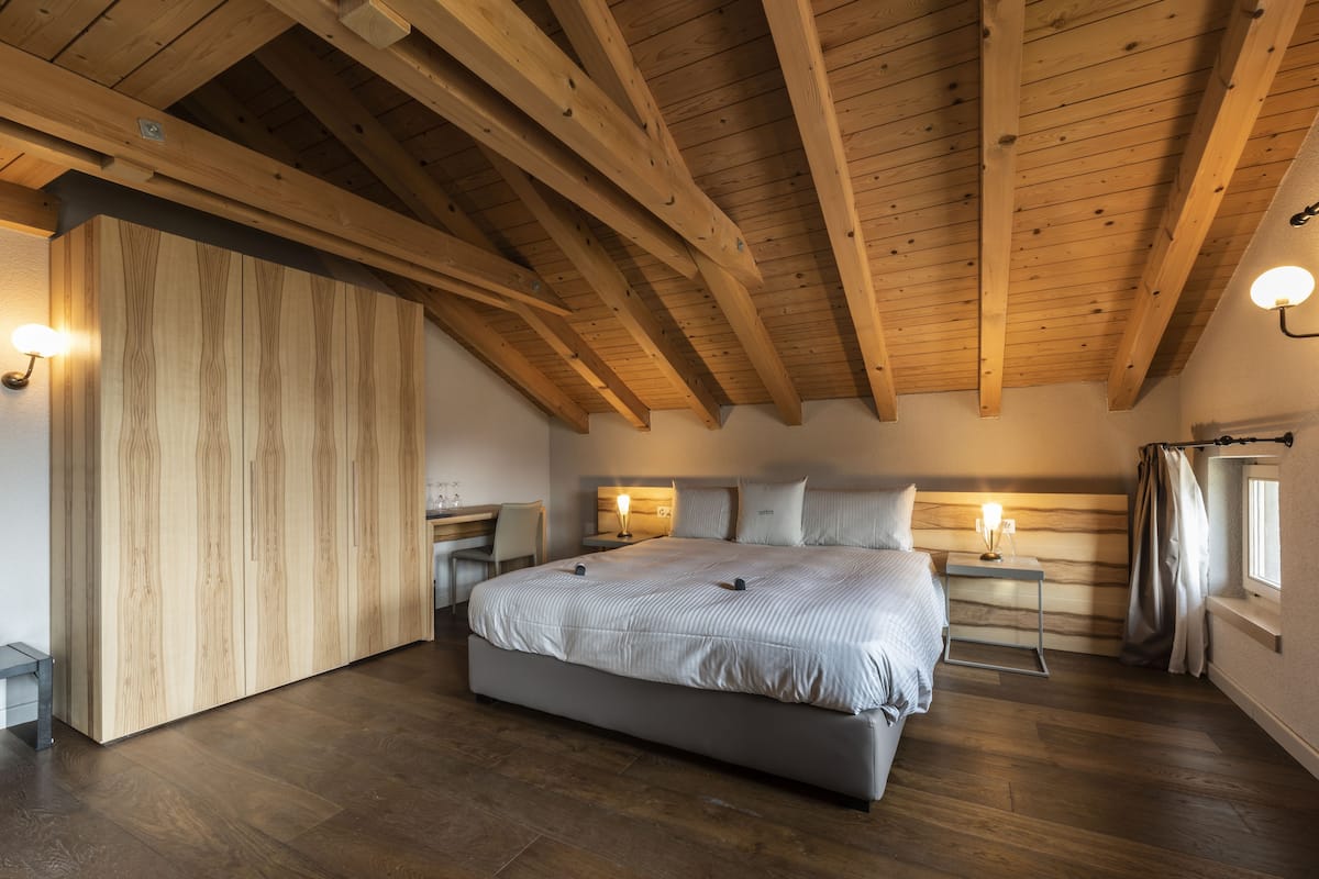 junior suite, 2 bedrooms, balcony, mountainside | minibar, in-room safe, desk, blackout curtains