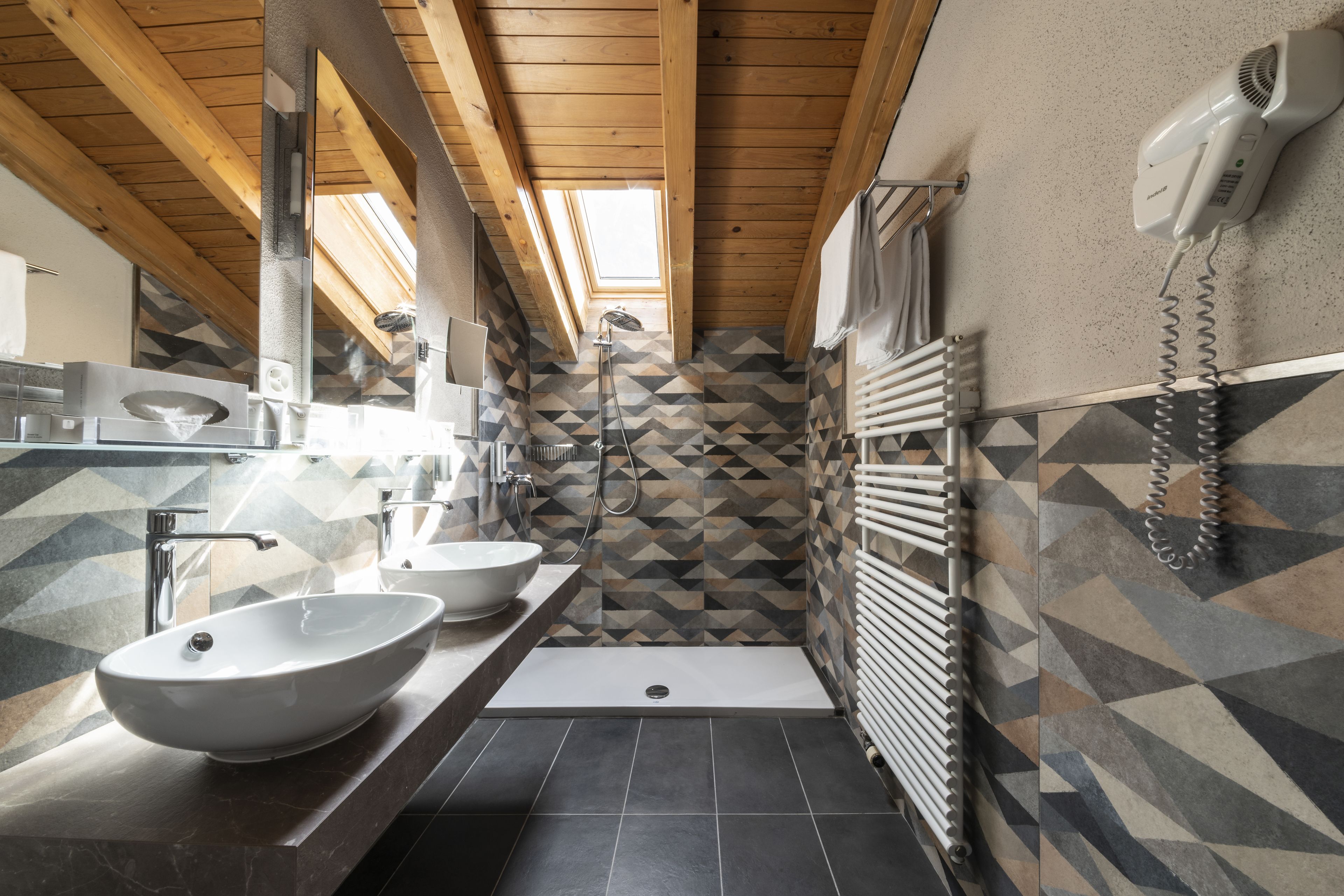 junior suite, 2 bedrooms, balcony, mountainside | bathroom | designer toiletries, hair dryer, bathrobes, slippers