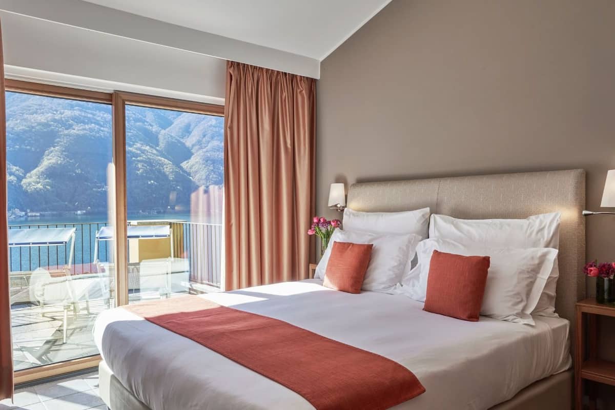 panoramic suite, terrace, lake view | hypo-allergenic bedding, down duvets, in-room safe