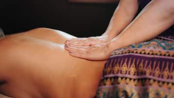 A massage being performed on a person's back.