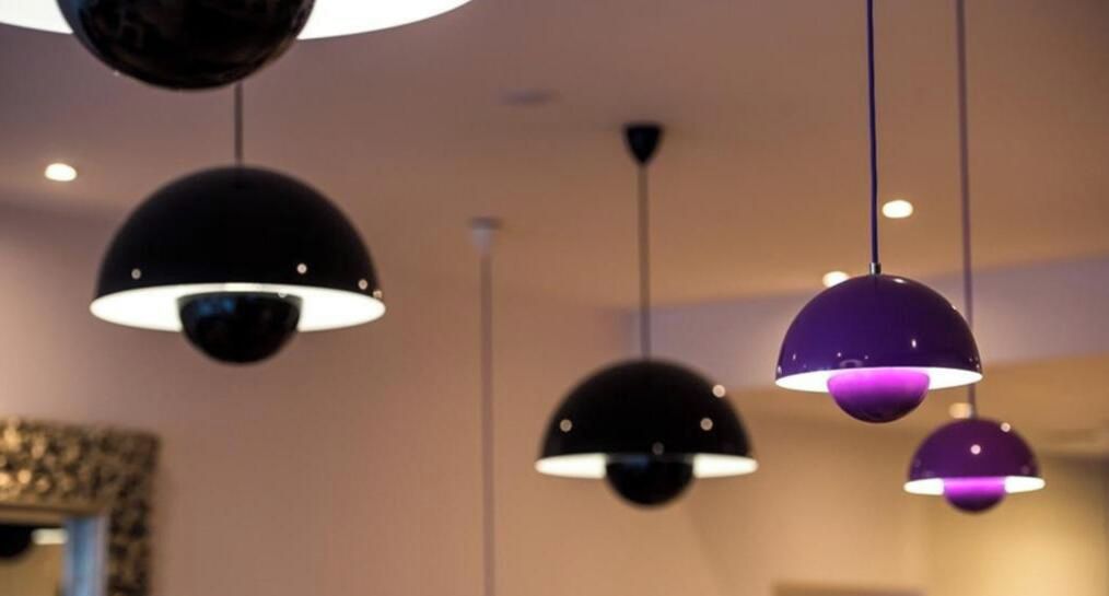 Pendant lights with a spherical design in a room.