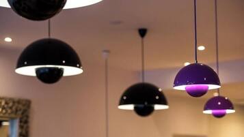 Pendant lights with a spherical design in a room.