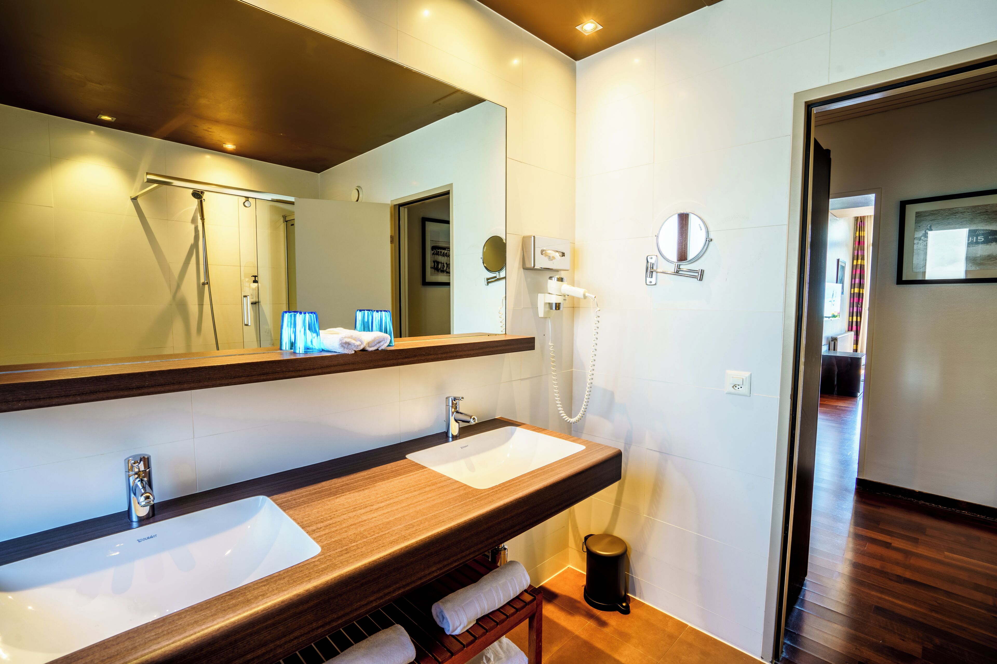 deluxe double room, balcony, lake view | bathroom | designer toiletries, hair dryer, towels
