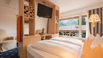 Habitación doble, 1 cama Queen size (Mezzo) | Ropa de cama de alta calidad y minibar