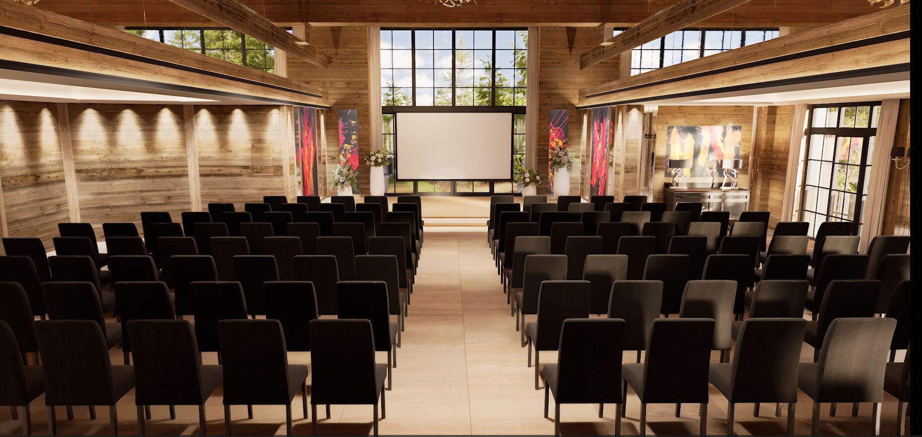 Un salón de conferencias con filas de sillas, una pantalla grande y paredes de madera.